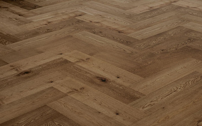 Closeup of a medium-beige W-patterned floor with wooden grooves and texture